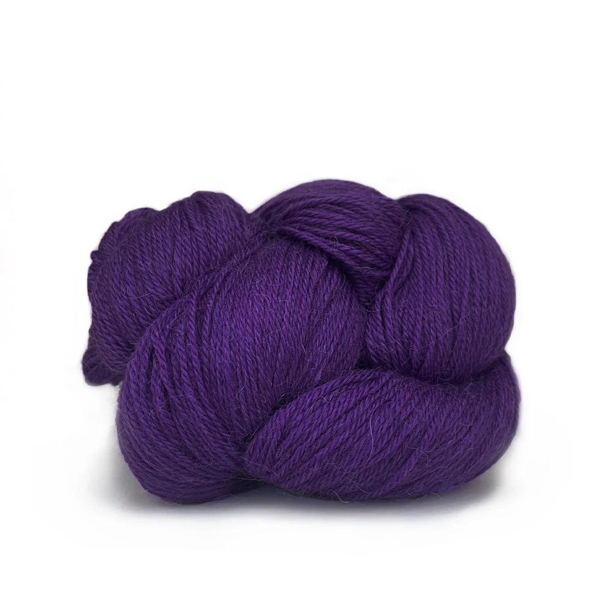 Close-up of a skein of vibrant purple Perennial yarn by Kelbourne Woolens in color Violet.