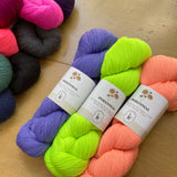 Kelbourne Woolens Perennial Yarn shown in various colors on display at the Hillsborough Yarn Shop, NC, USA.