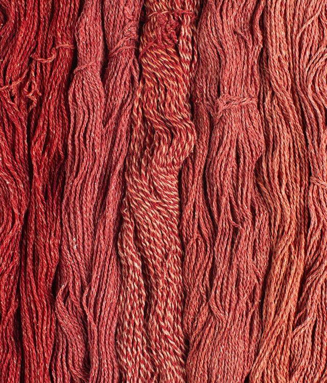 Skeins of rust red Brooklyn Tweed Dapple yarn. 