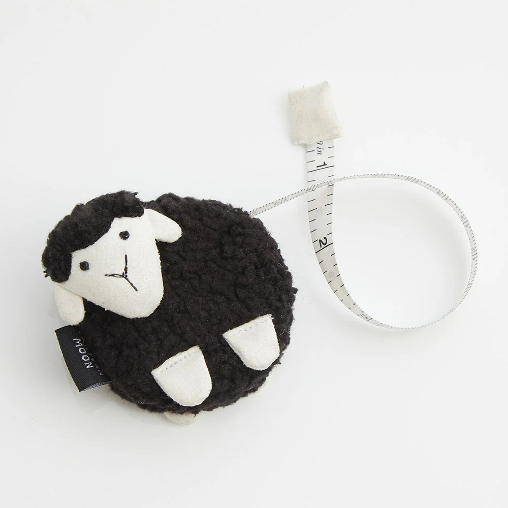 Black sheep-shaped tape measure. 