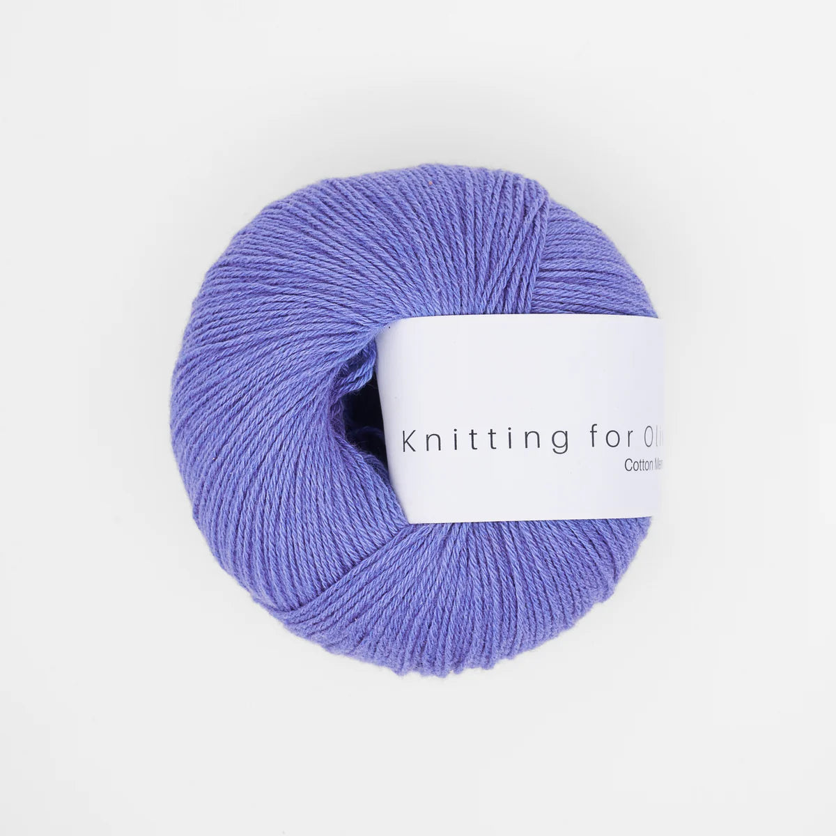 Ball of lavender blue yarn with a label on a white background