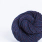 Purplish blue ball of Brooklyn Tweed Loft yarn. 