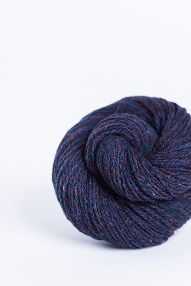 Purplish blue ball of Brooklyn Tweed Loft yarn. 