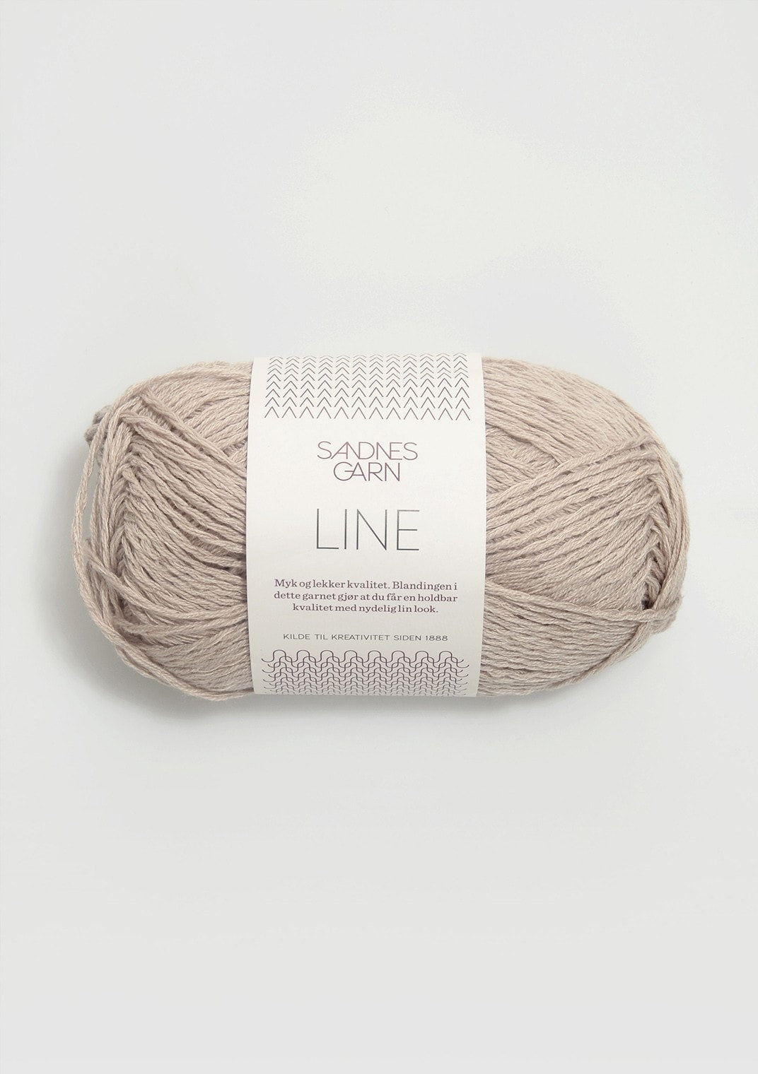 Pale beige ball of Sandnes Garn Line yarn. 