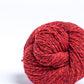 Marled red ball of Brooklyn Tweed Loft yarn. 