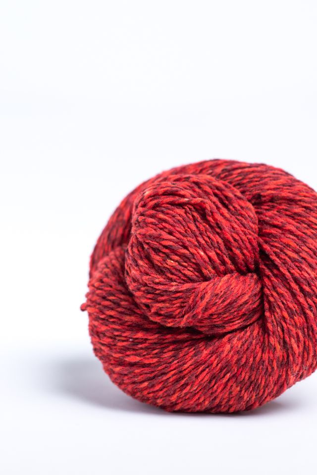 Marled red ball of Brooklyn Tweed Loft yarn. 