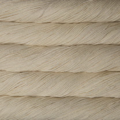 Skein of natural white Malabrigo Arroyo yarn. 