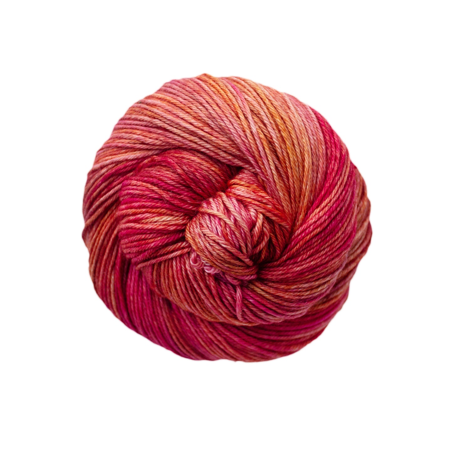 Skein of orange, red, and yellow Malabrigo Arroyo yarn. 