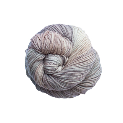Skein of variegated beige, gray, and taupe Malabrigo Arroyo yarn. 