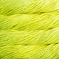 Close up on neon yellow skein of Malabrigo Rasta yarn in color Fluo. 