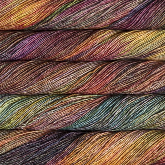 Variegated skeins yarn in warm shades of mauve, moss green, and yellow- Ultimate Sock by Malabrigo in Diana