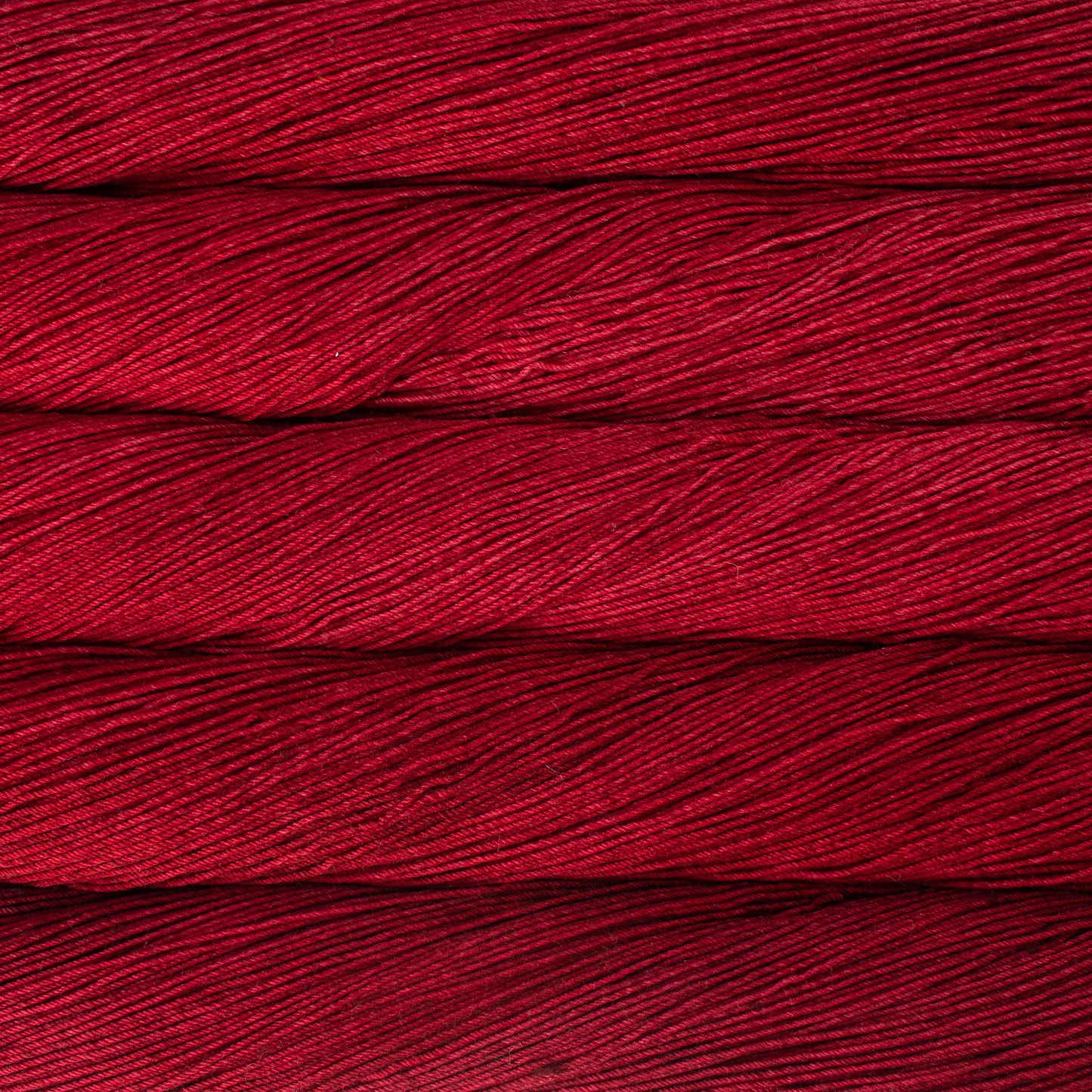 Variegated skeins of red yarn - Ultimate Sock by Malabrigo 