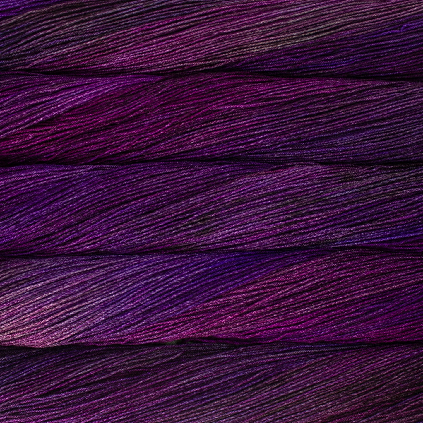 Variegated skeins of purple and magenta yarn - Ultimate Sock by Malabrigo 