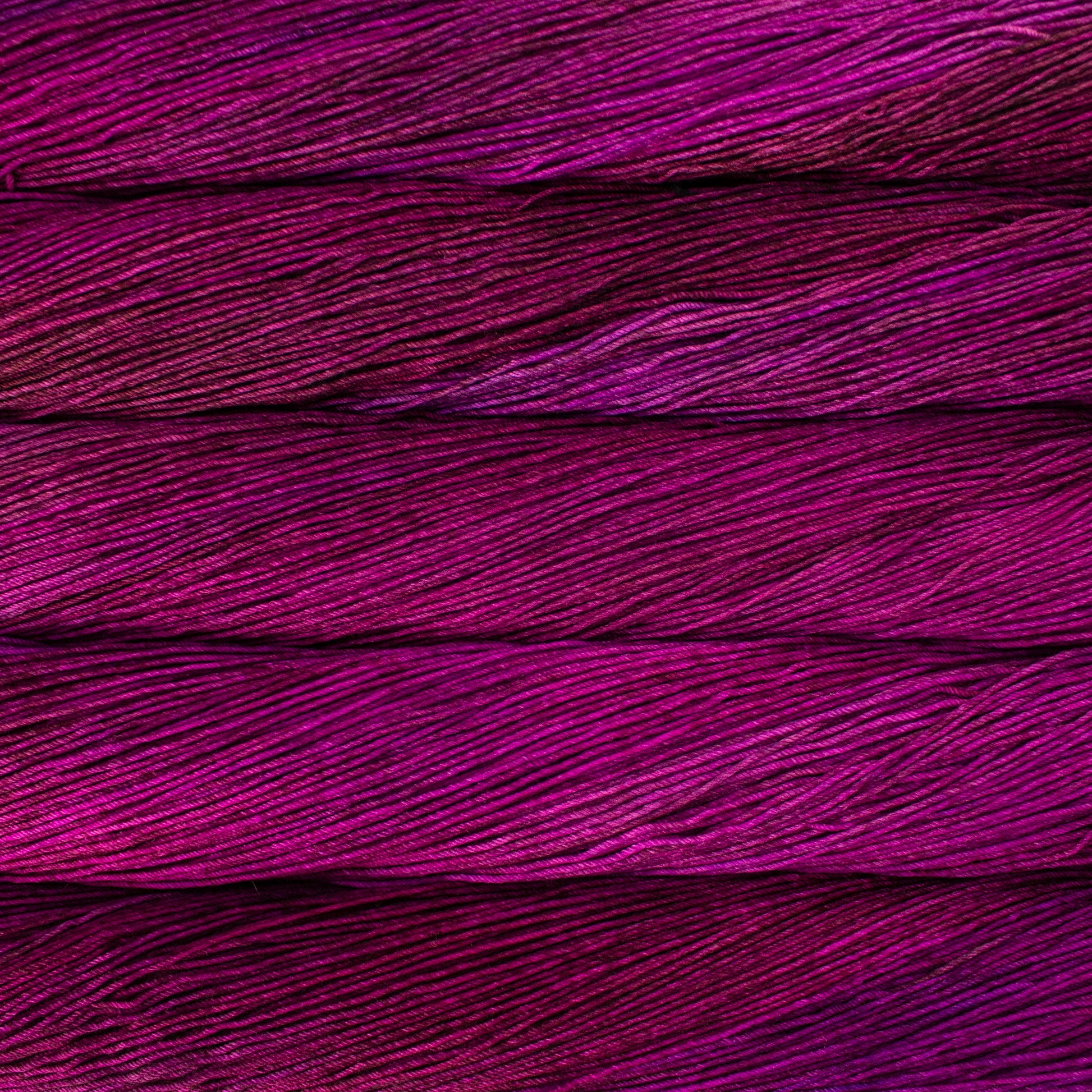 Variegated skeins of magenta yarn - Ultimate Sock by Malabrigo 