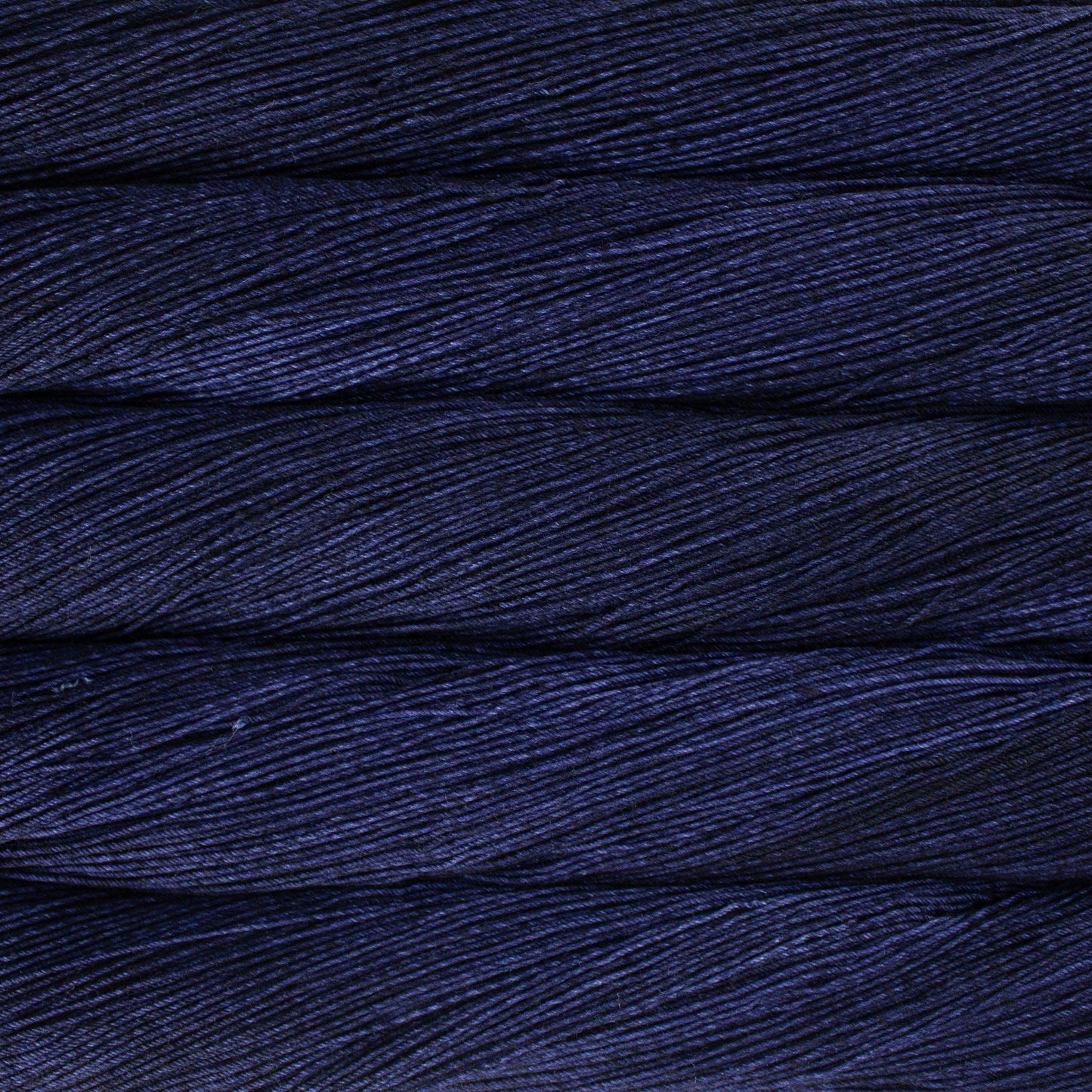 Variegated skeins of deep indigo yarn - Ultimate Sock by Malabrigo in Cote de Azure