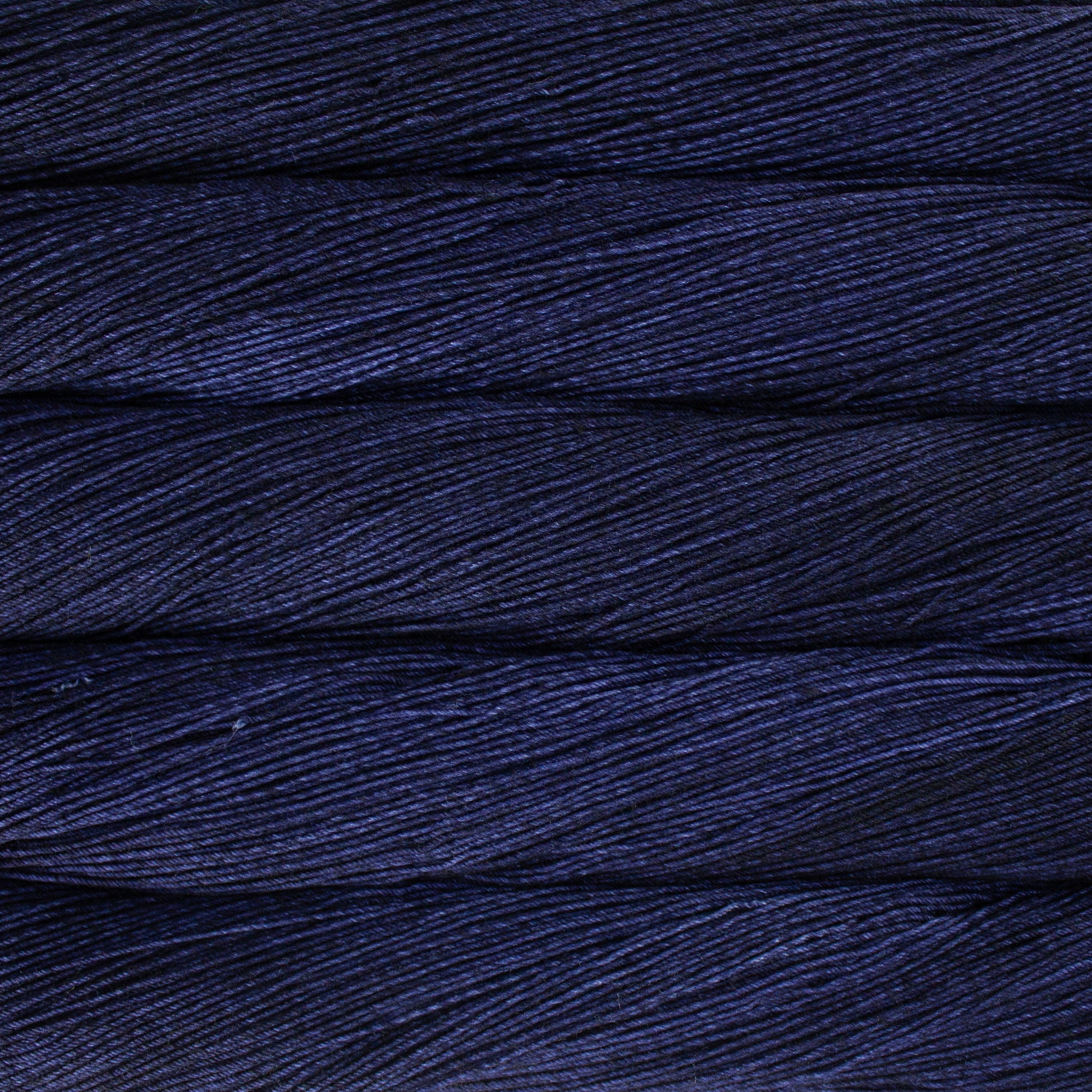 Variegated skeins of deep indigo yarn - Ultimate Sock by Malabrigo in Cote de Azure