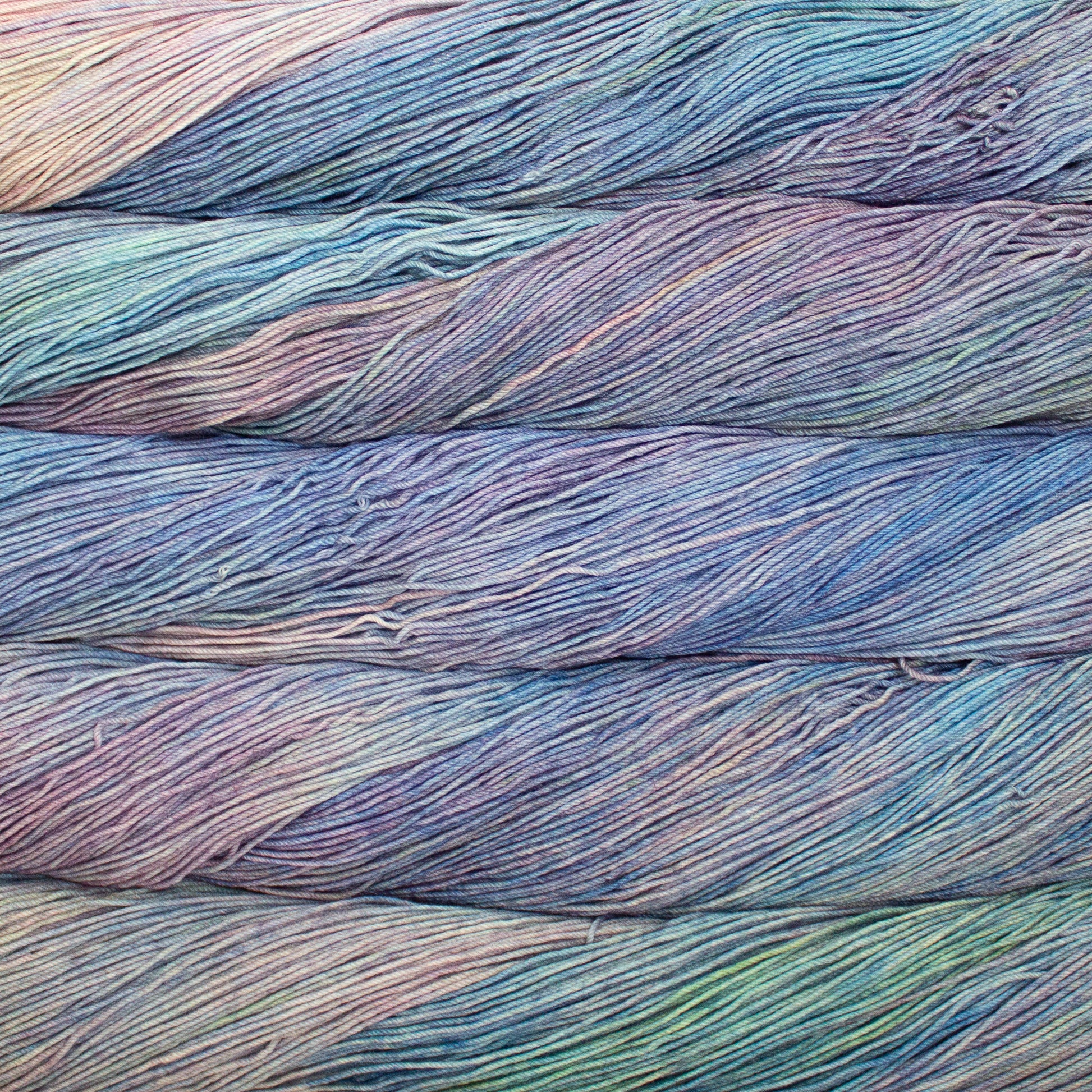 Variegated skeins of pastel blue, lilac, and green yarn - Ultimate Sock by Malabrigo in Arapey