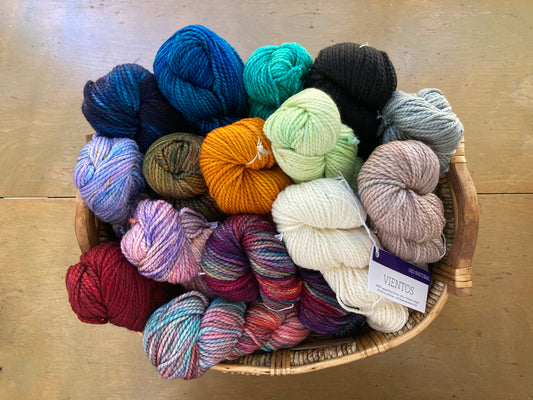 Basket full of colorful Malabrigo Vientos yarn 