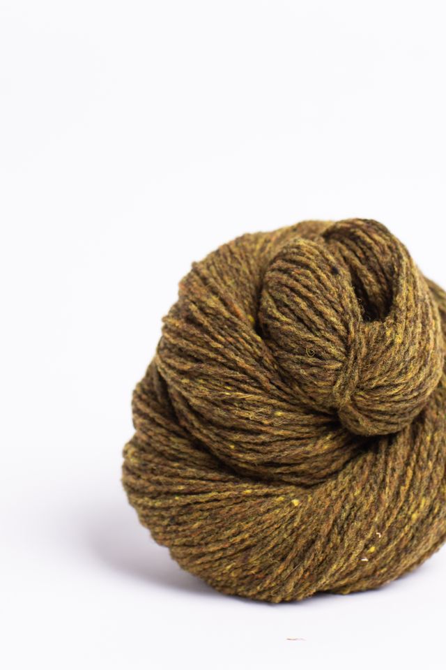 Ochre ball of Brooklyn Tweed Loft yarn. 