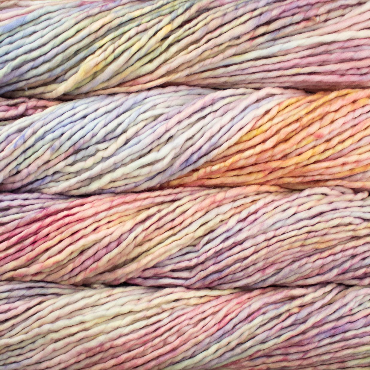 Close up on pastel variegated skein of Malabrigo Rasta yarn. 