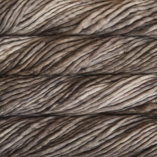 Close up on variegated taupe skein of Malabrigo Rasta yarn. 