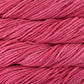 Close up on tropical pink skein of Malabrigo Rasta yarn in color Cactus Flower. 