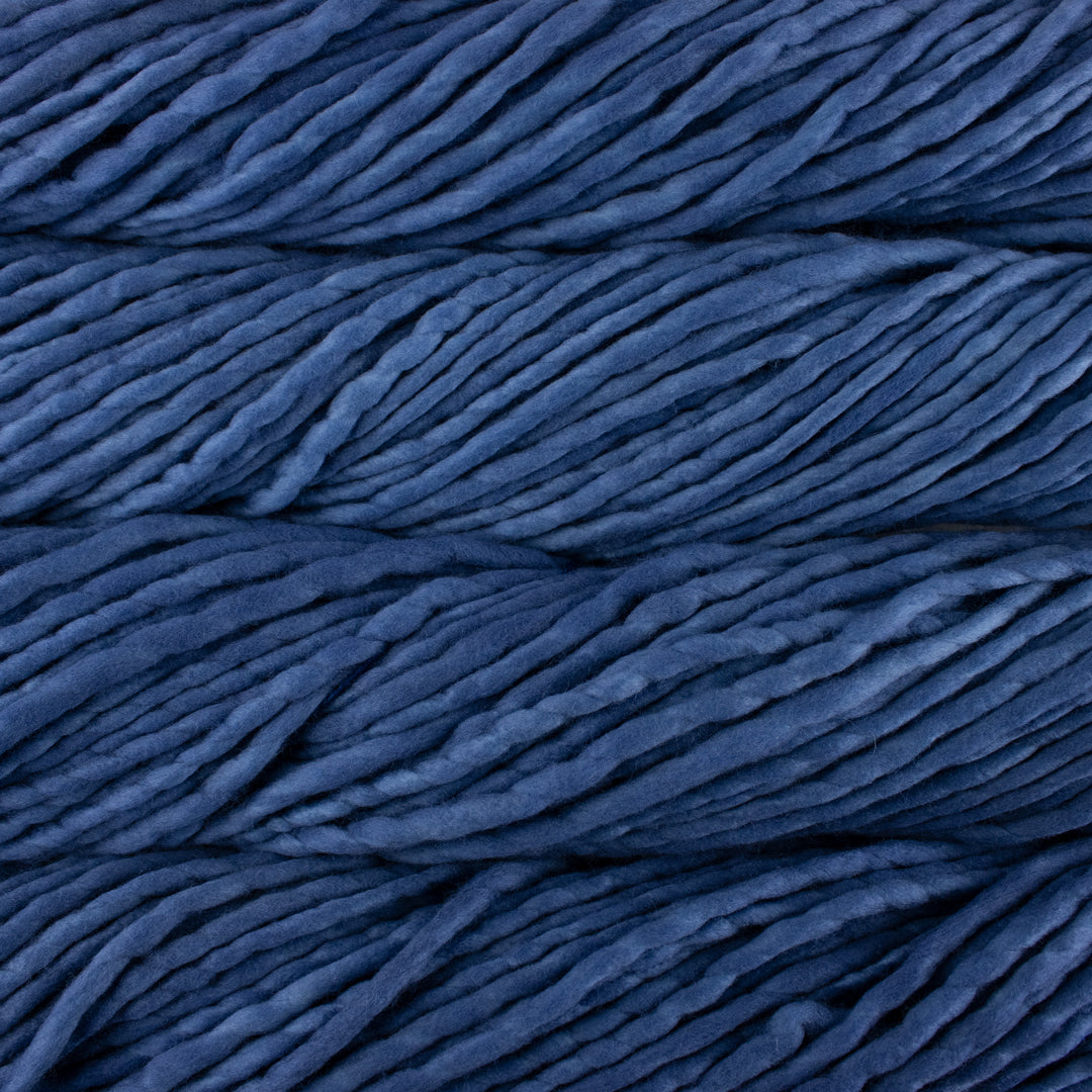 Close up on denim blue skein of Malabrigo Rasta yarn. 