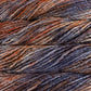 Close up on burnt orange lavender gray skein of Malabrigo Rasta yarn in color Plumage. 