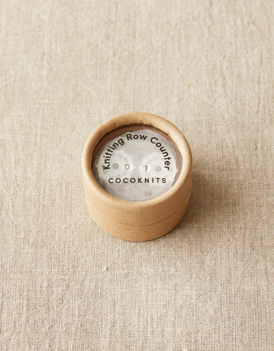 Kraft brown package with cocoknits row counter inside. 