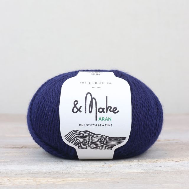 Dark blue ball of Fibre Co. & Make Aran yarn. 