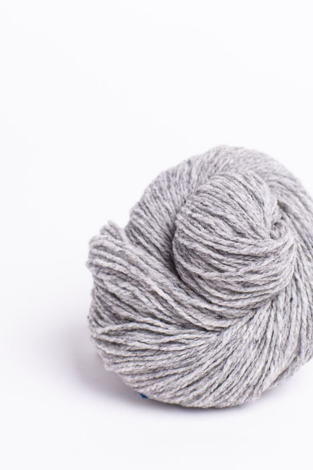 Heathered gray ball of Brooklyn Tweed Loft yarn. 