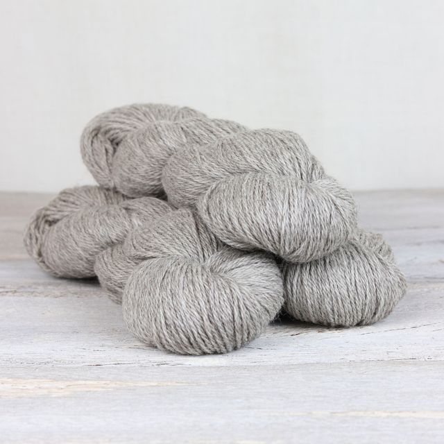 3 skeins of light heathered gray Fibre Co. Cumbria yarn. 