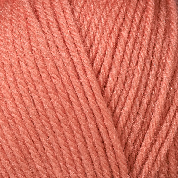 Close up on bright orange ball of Berroco Ultra Wool yarn.