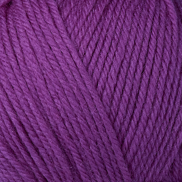 Close up on magenta ball of Berroco Ultra Wool yarn.