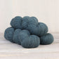 3 skeins of teal blue Fibre Co. Amble yarn. 