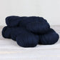 3 skeins of navy blue Fibre Co. Cumbria yarn. 