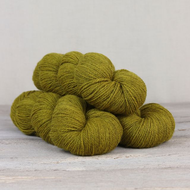 3 skeins of chartreuse Fibre Co. Amble yarn. 