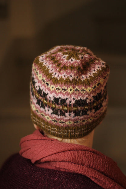 Designer Gudrun Johnston models the Simply Shetland Holiday Hat for 2024.