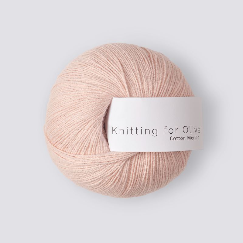 Ball of light pink yarn with 'Knitting for Olive' label on a light gray background