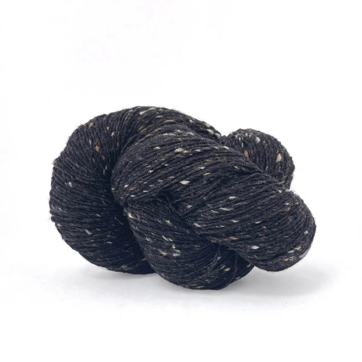 Skein of black tweed Kelbourne Woolens Cricket yarn. 