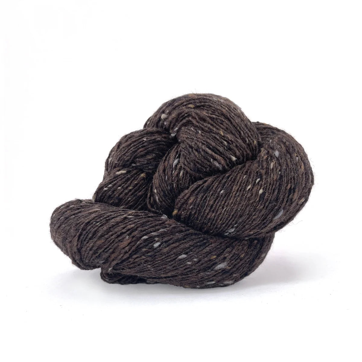 Skein of chocolate brown tweed Kelbourne Woolens Cricket yarn. 