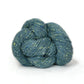 Skein of blue green tweed Kelbourne Woolens Cricket yarn. 