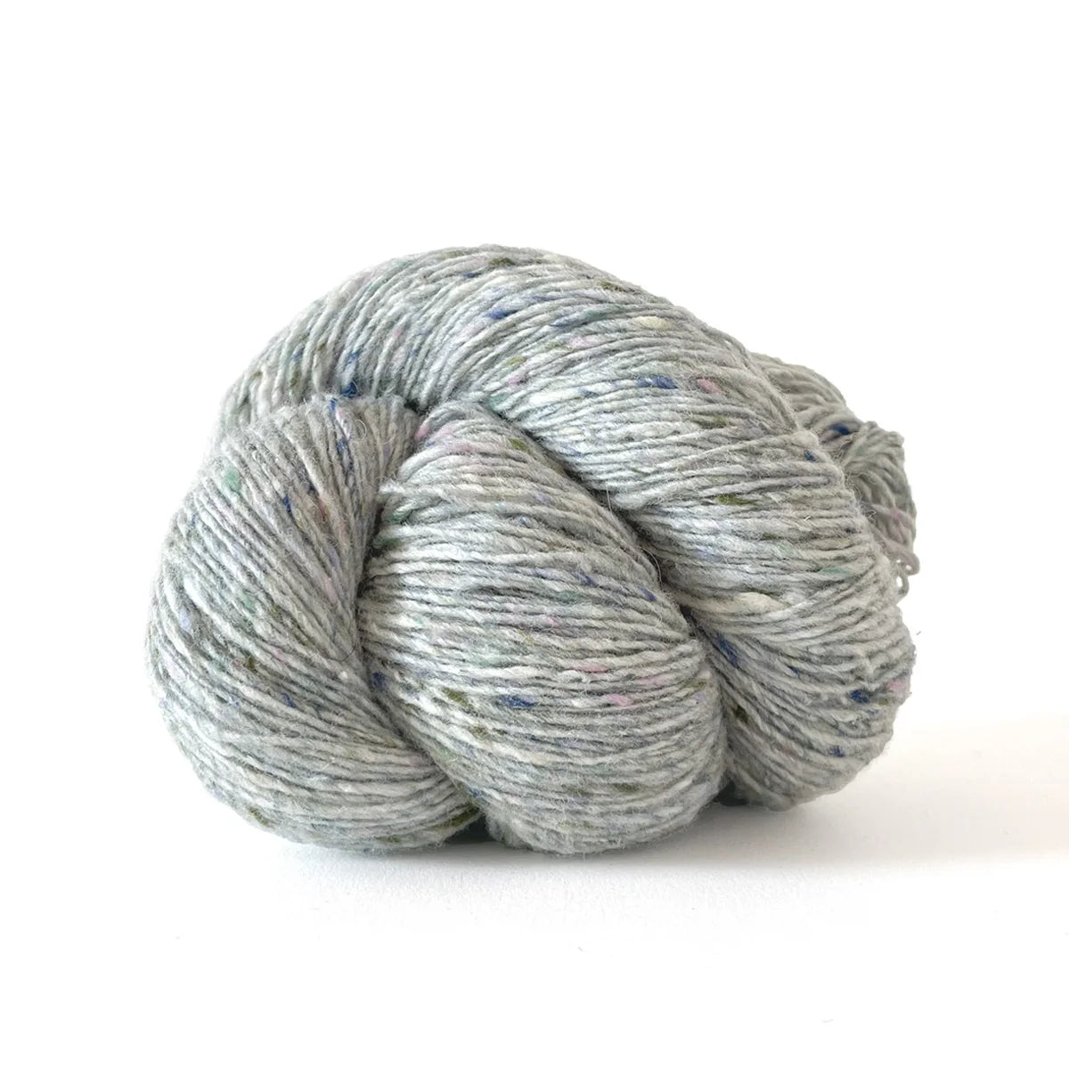 Skein of light blue green tweed Kelbourne Woolens Cricket yarn. 