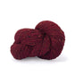 Skein of dark red tweed Kelbourne Woolens Cricket yarn. 