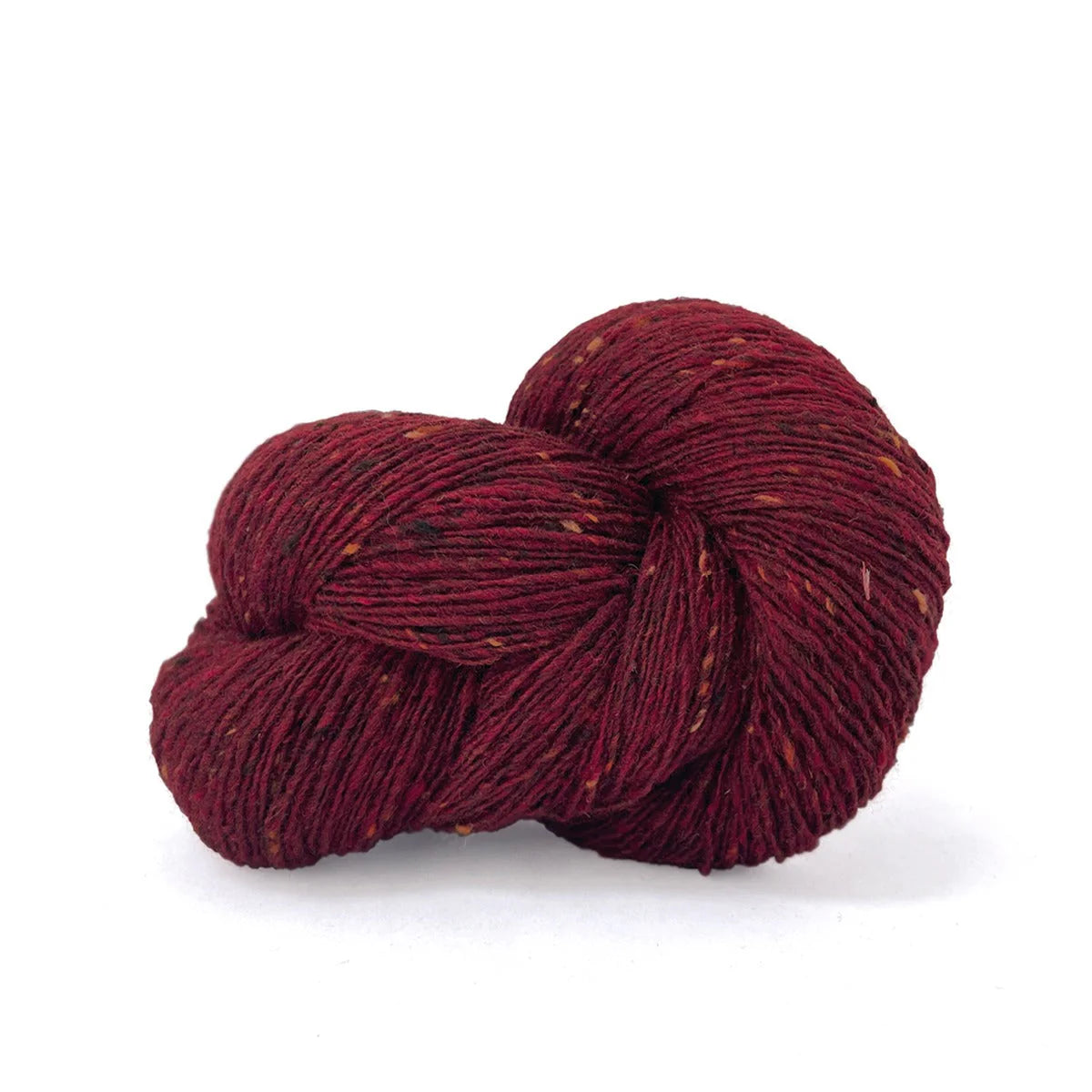 Skein of dark red tweed Kelbourne Woolens Cricket yarn. 