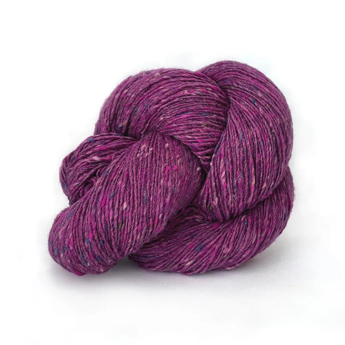 Skein of magenta tweed Kelbourne Woolens Cricket yarn. 