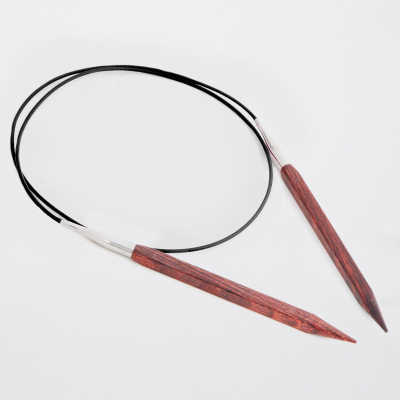 Brown circular needles connected by a black cord. 