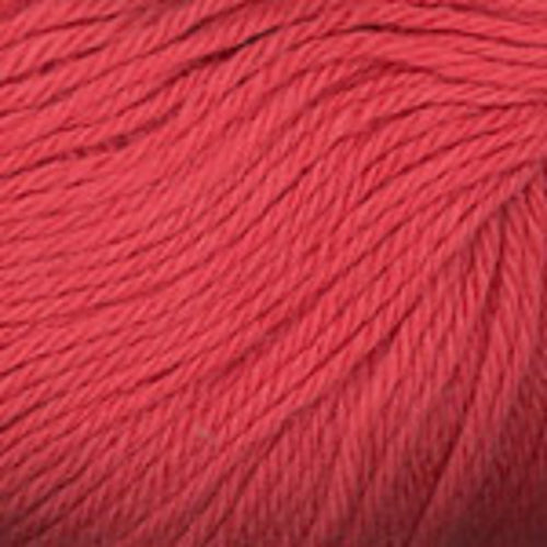 Close up on a coral pink ball of Plymouth Baby Alpaca DK yarn.