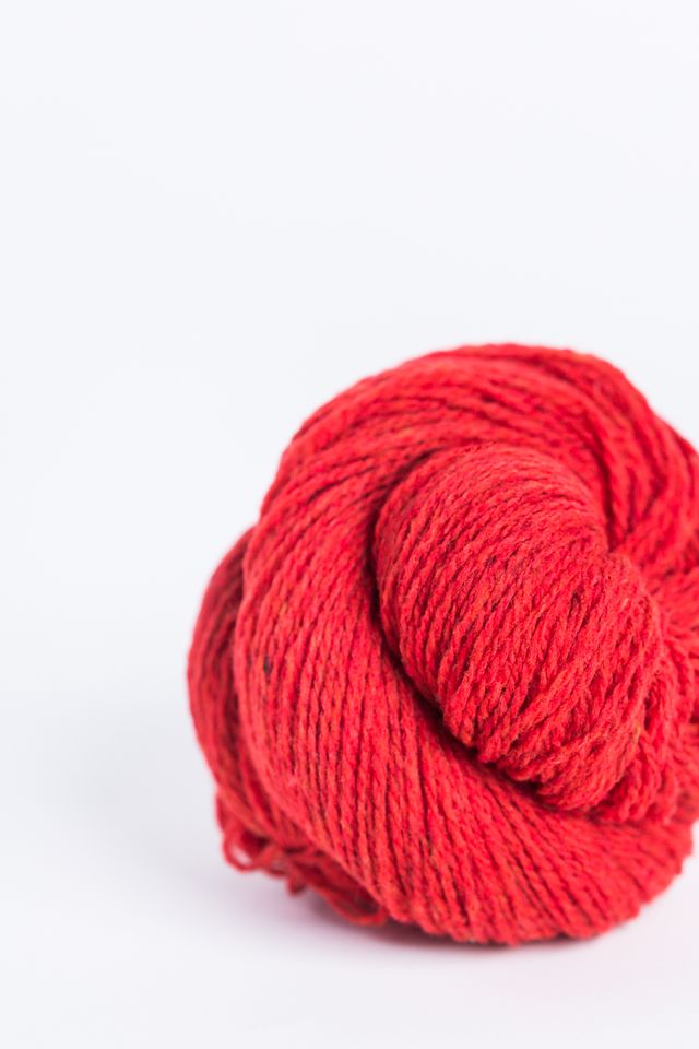 Bright red ball of Brooklyn Tweed Loft yarn. 