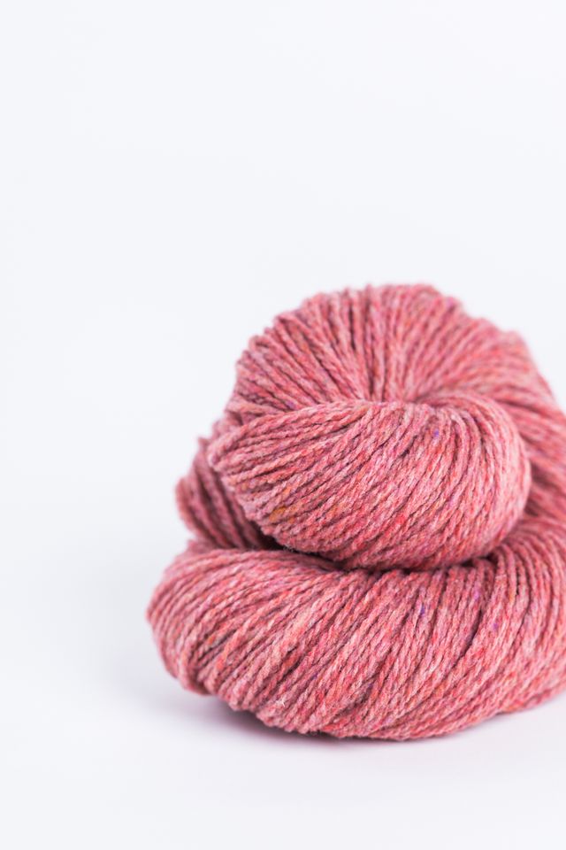 Salmon pink ball of Brooklyn Tweed Loft yarn. 